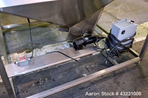 Used Bulk Elevator Feeder, Stainless Steel. Approximate 10" wide x 84 long pleated belt, approximate 80" discharge height. 56 x 42 x 24 Deep bulk supply hopper. Driven by a 1/4 hp, 90 volt DC gear mo...
