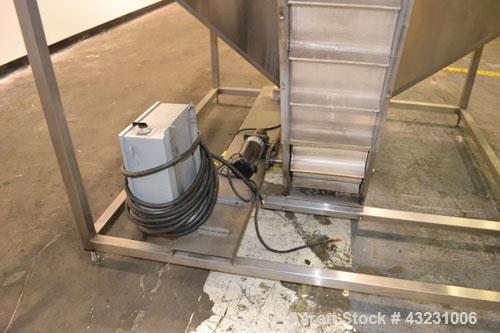 Used Bulk Elevator Feeder, Stainless Steel. Approximate 10" wide x 84 long pleated belt, approximate 80" discharge height. 56 x 42 x 24 Deep bulk supply hopper. Driven by a 1/4 hp, 90 volt DC gear mo...