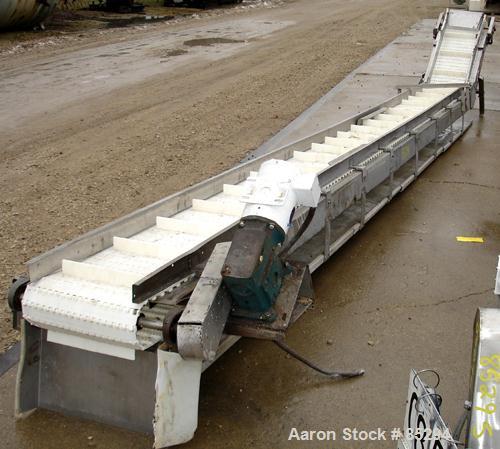 Used Incline Belt Conveyor, 304 stainless steel frame. Plastic belt 18" wide x 48" long bottom section x 140 degree 20' long incline section. Driven by a 1 hp, 3/60/208-230/460 volt, 1725 rpm gearmot...