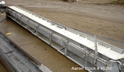 Used Incline Belt Conveyor, 304 stainless steel frame. Plastic belt 18" wide x 48" long bottom section x 140 degree 20' long incline section. Driven by a 1 hp, 3/60/208-230/460 volt, 1725 rpm gearmot...