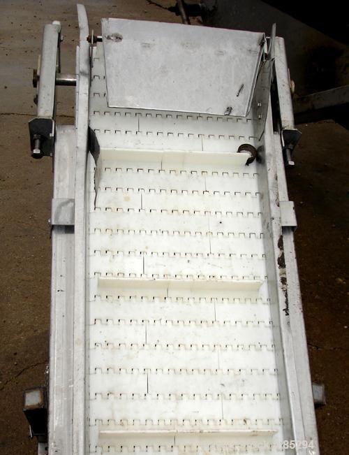 Used Incline Belt Conveyor, 304 stainless steel frame. Plastic belt 18" wide x 48" long bottom section x 140 degree 20' long incline section. Driven by a 1 hp, 3/60/208-230/460 volt, 1725 rpm gearmot...