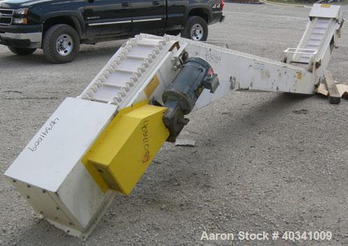 Used Rapat Corp "S" shaped flexwall incline conveyor, model FLX21.516. Carbon steel frame, approximately 12" wide cleated rubber belt, 1" tall accordion sides, 51" long top infeed section, 12' long i...