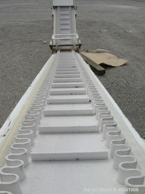 Used Rapat Corp "S" shaped flexwall incline conveyor, model FLX21.516. Carbon steel frame, approximately 12" wide cleated rubber belt, 1" tall accordion sides, 51" long top infeed section, 12' long i...