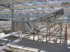 Used Incline conveyor 20 inch wide x 14 feet long to 6 foot high elevation with air cylinder to raise and lower the infeed section.  Hopper side walls to fill with chilled water, used as quench tank ...