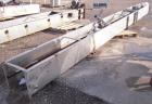 Used- Approximately 14 inch wide x 34 foot long drag chain conveyor, stainless steel housing with carbon steel chain and som...