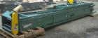 Used Titan Industries Pleated Belt Conveyor, model 304, carbon steel. 24’’ Wide x 208’’ long rubber belt with 11-1/2’’ long pockets with 2-1/2’’ tall pleats. 180’’ Long section of Lexan sheet top cov...