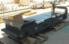 Used Titan Industries Pleated Belt Conveyor, model 304, carbon steel. 24’’ Wide x 118’’ long rubber belt with 11-1/2’’ long pockets with 2-1/2’’ tall pleats. 88’’ Long section of Lexan sheet top cove...