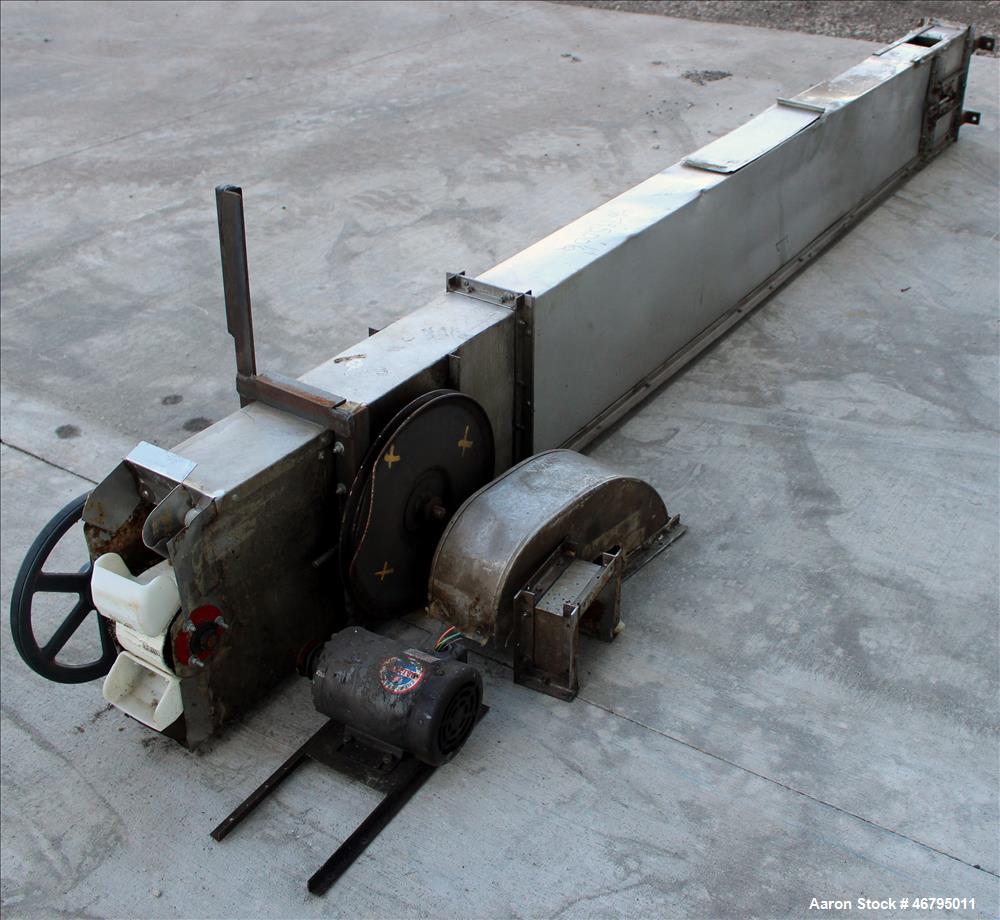 Used Bucket Elevator, Vertical. Approximate 12' Tall housing with 3-1/4" long x 4" wide x 3" deep poly buckets on 5-1/2" centers. Driven by a 0.5hp, 3/60/208-230/460 volt, 1725 rpm motor. 304 Stainle...