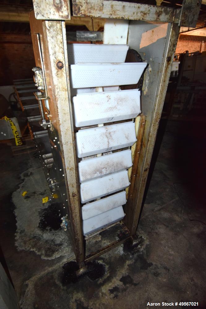 Used Schebbler Bucket Elevator. Plastic buckets approximate 14-1/2" wide x 6" long x 4" deep, stainless steel housing. Bottom horizontal section approximate 4' long, vertical section approximate 15' ...