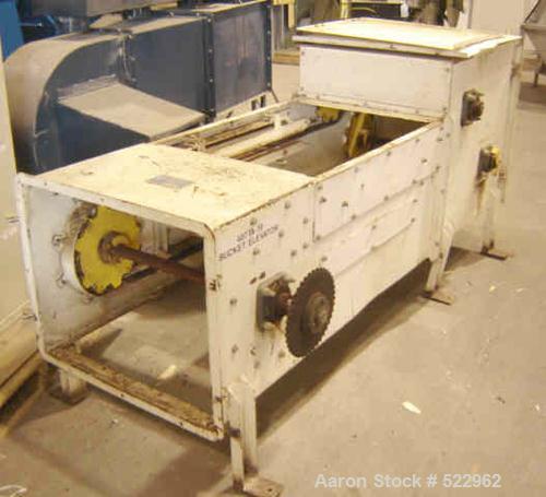 USED: 18' discharge height Gough Econ zig-zag bucket elevator. Dateof manufacture 11/13/91. 2 hp, 230/460 volt, 1730 rpm motor with gearreducer and chain drive. Elevator vertical section interior dim...
