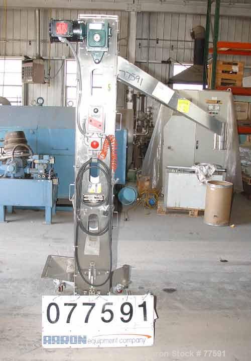 Used Kamflex Design Vertical Belt Conveyor. 10" Wide x 7'7.58" long rubber belt with 10" wide x 1-1/2" deep pockets, 43" discharge height with a 3-3/4" diameter discharge. Product density 30 lbs/cubi...