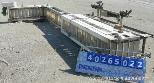 Unused- Deamco Overlapping Bucket Elevator, Model BES-12P-T, carbon steel.  Approximately 189" tall.  Plastic buckets 12" long x 4" wide x approximately 2 1/2" deep.  Driven by a 1/2 hp, 3/60/230/460...