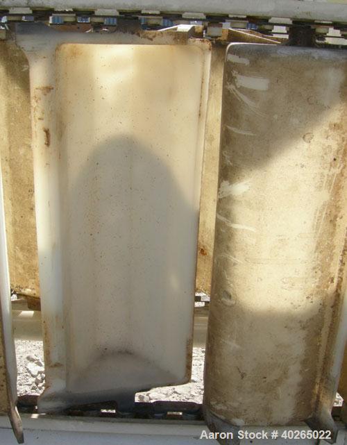 Unused- Deamco Overlapping Bucket Elevator, Model BES-12P-T, carbon steel.  Approximately 189" tall.  Plastic buckets 12" long x 4" wide x approximately 2 1/2" deep.  Driven by a 1/2 hp, 3/60/230/460...