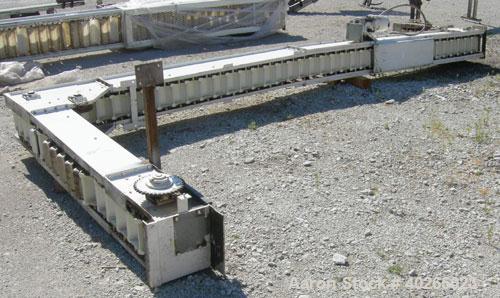 Used Deamco Corp. Overlapping Bucket Elevator, Carbon Steel. Approximately 17'-5" tall. Plastic buckets 6" long x 4" wide x approximately 2-1/2" deep. Approximate 35" long bottom horizonatl section x...