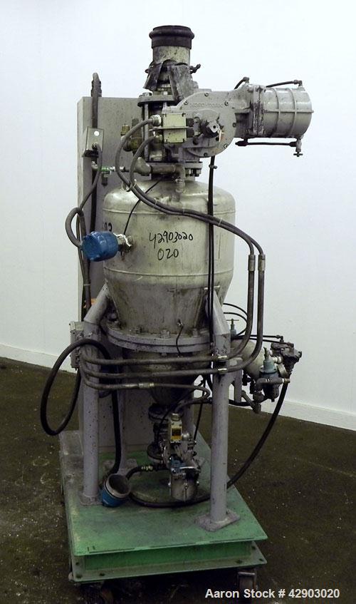Used Nippon Pneumatic Conveyor, Model HT, 304 Stainless Steel. Includes a control panel. Mounted on a carbon steel base with casters.