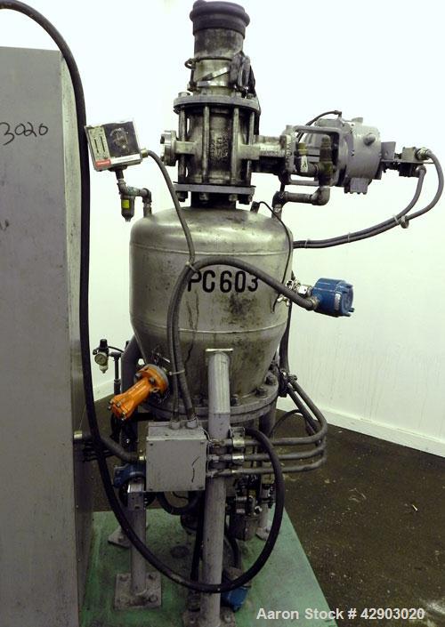 Used Nippon Pneumatic Conveyor, Model HT, 304 Stainless Steel. Includes a control panel. Mounted on a carbon steel base with casters.