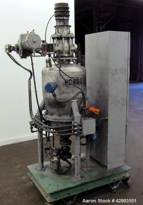 Used Nippon Pneumatic Conveyor, Model HT, 304 Stainless Steel. Includes a control panel. Mounted on a carbon steel base with casters.