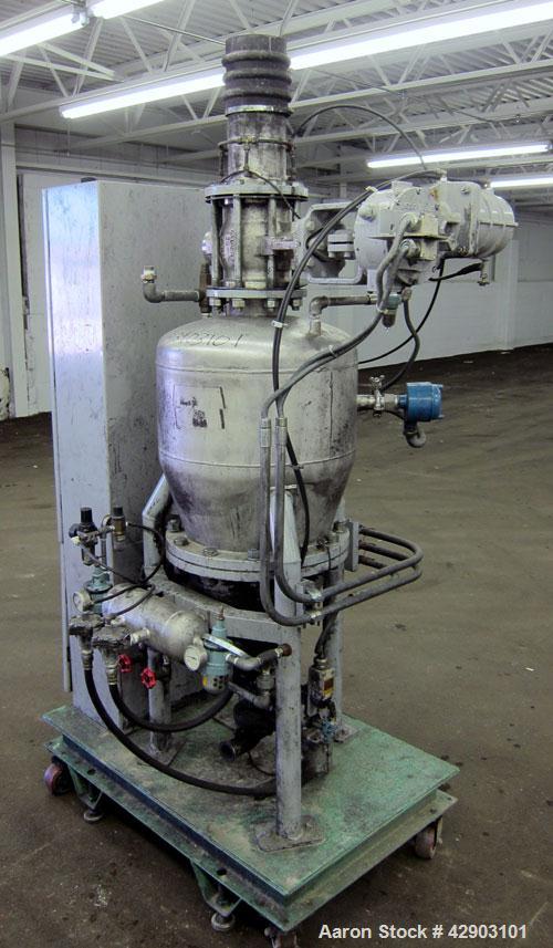 Used Nippon Pneumatic Conveyor, Model HT, 304 Stainless Steel. Includes a control panel. Mounted on a carbon steel base with casters.