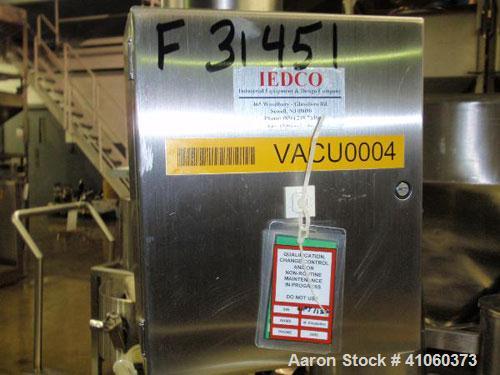 Used PIAB vacuum conveyor system, stainless steel construction with model MLL200 vacuum pump with filter, mounted on protable stainless steel stand with reciever, ART#34.01.056.
