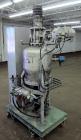 Used Nippon Pneumatic Conveyor, Model HT, 304 Stainless Steel. Includes a control panel. Mounted on a carbon steel base with casters.