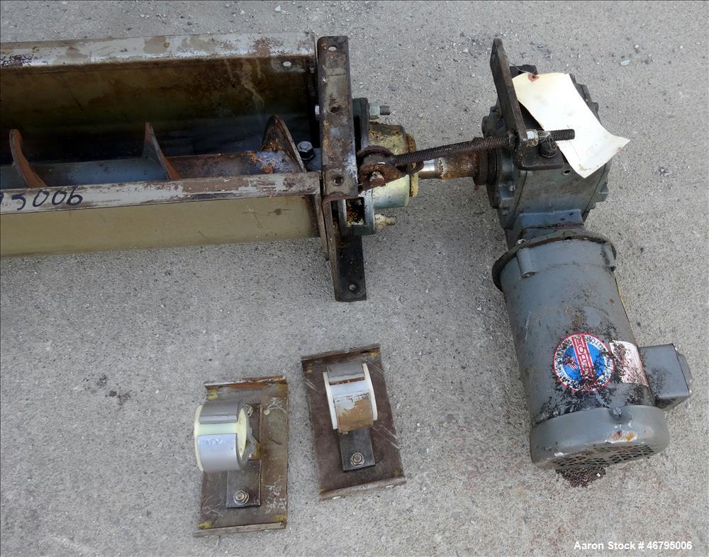 Used Screw Conveyor, Horizontal. Carbon steel screw 6" diameter x 40' long x 6" pitch. 304 Stainless steel trough, approximate 40' long x 7" wide x 8" deep, no top cover. Driven by a 1hp, 3/60/208-23...