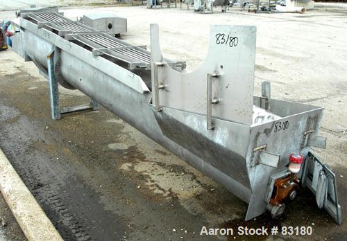 USED: Incline screw conveyor, 304 stainless steel. 14" diameter x 12'6" long x 6" pitch screw, approximately 1/2" thick Teflon screw tip. End feed with bin, top bottom outlet. Top safety grate sectio...