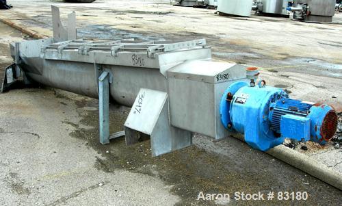 USED: Incline screw conveyor, 304 stainless steel. 14" diameter x 12'6" long x 6" pitch screw, approximately 1/2" thick Teflon screw tip. End feed with bin, top bottom outlet. Top safety grate sectio...