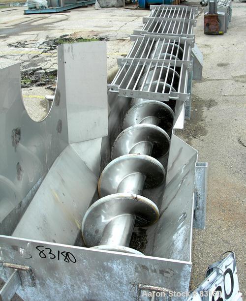 USED: Incline screw conveyor, 304 stainless steel. 14" diameter x 12'6" long x 6" pitch screw, approximately 1/2" thick Teflon screw tip. End feed with bin, top bottom outlet. Top safety grate sectio...