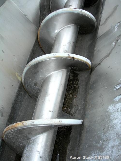USED: Incline screw conveyor, 304 stainless steel. 14" diameter x 12'6" long x 6" pitch screw, approximately 1/2" thick Teflon screw tip. End feed with bin, top bottom outlet. Top safety grate sectio...