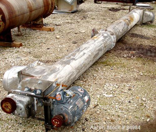 USED: Screw conveyor, enclosed tube, 304 stainless steel, horizontal. 12" diameter x 216" long screw. 12" x 12" end top feed, 12" x 12" end bottom outlet. Driven by a 10 hp, 3/60/208-230/460 volt, 17...