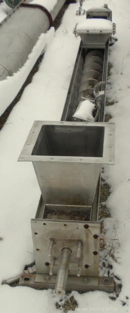 Used Screw Conveyor, 316 Stainless Steel. 6" diameter x 10' long, dimple jacketed. 6" pitch. 10" x 10" top infeed, 8" x 8" discharge. No drive or top cover.