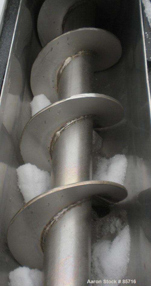Used Screw Conveyor, 316 Stainless Steel. 6" diameter x 10' long, dimple jacketed. 6" pitch. 10" x 10" top infeed, 8" x 8" discharge. No drive or top cover.