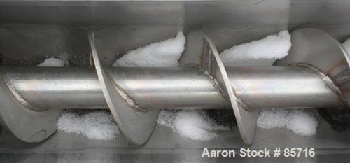Used Screw Conveyor, 316 Stainless Steel. 6" diameter x 10' long, dimple jacketed. 6" pitch. 10" x 10" top infeed, 8" x 8" discharge. No drive or top cover.