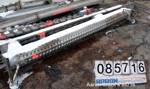 Used Screw Conveyor, 316 Stainless Steel. 6" diameter x 10' long, dimple jacketed. 6" pitch. 10" x 10" top infeed, 8" x 8" discharge. No drive or top cover.