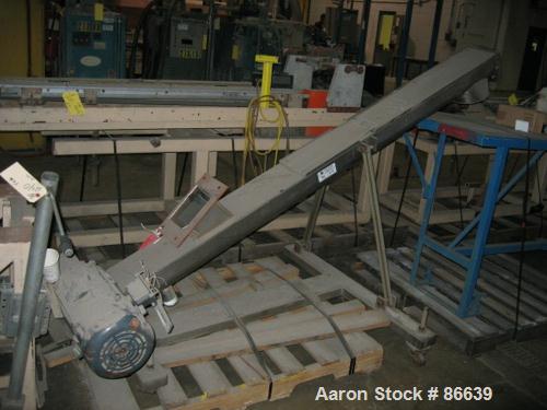USED: 8" stainless steel screw conveyor, 8" diameter x 88" long trough, 3.5" pitched flites, 8" diameter discharge with approximate 40" discharge height, with 1 hp 200 volt DC motor missing controlle...