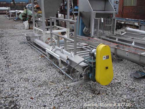 USED: Inclined screw conveyor, stainless steel. 6" diameter x 14' long screw. 8" diameter x 14' long enclosed tube with a feed hopper, approximate 10' discharge height. Driven by a 1 hp, 3/60/230/460...
