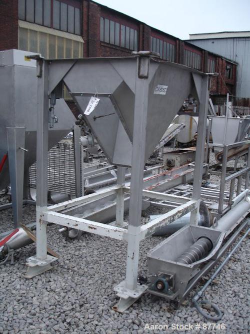 USED: Inclined screw conveyor, stainless steel. 6" diameter x 14' long screw. 8" diameter x 14' long enclosed tube with a feed hopper, approximate 10' discharge height. Driven by a 1 hp, 3/60/230/460...