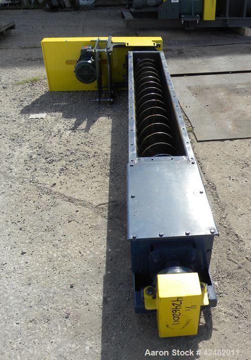 Unused- Goodman Conveyor Company Screw Conveyor, Carbon Steel. 9" Diameter x 85" long x 4-1/2’’ pitch screw, 10" wide trough with (1) section of bolt on top cover. 10’’ x 10’’ outlet. Driven by a 5 h...