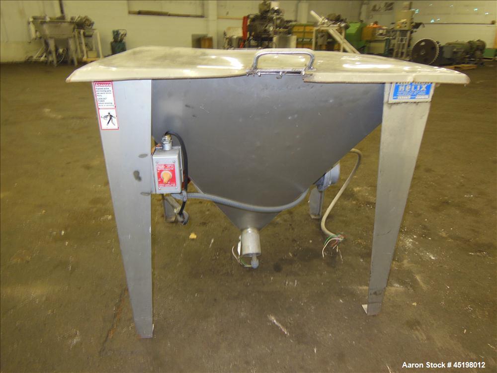 Used Hapman Flexible Screw Conveyor Parts Consisting Of: (1) 35" x 29" x 41" deep feed hopper with a 1 piece cover, (1) 1.5hp, 3/60/208-230/460 volt, 1725 rpm gear motor, ratio 10 to 1, control panel...