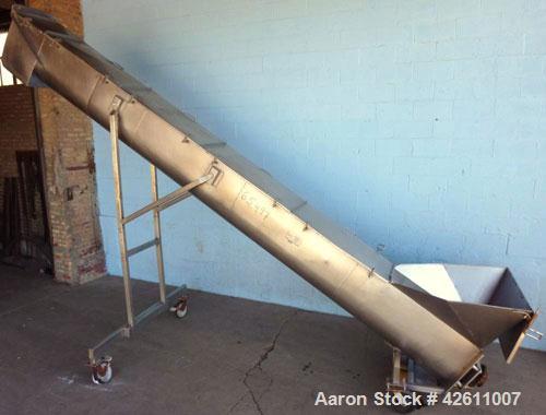 Used Material Transportation Company (MTC) Screw Conveyor, model MTCS8-18-19, stainless steel. 16" Diameter X 204" long screw. Discharge height is approximately 135 inches. Discharge opening is 18" X...