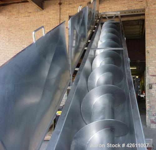 Used Material Transportation Company (MTC) Screw Conveyor, model MTCS8-18-19, stainless steel. 16" Diameter X 204" long screw. Discharge height is approximately 135 inches. Discharge opening is 18" X...