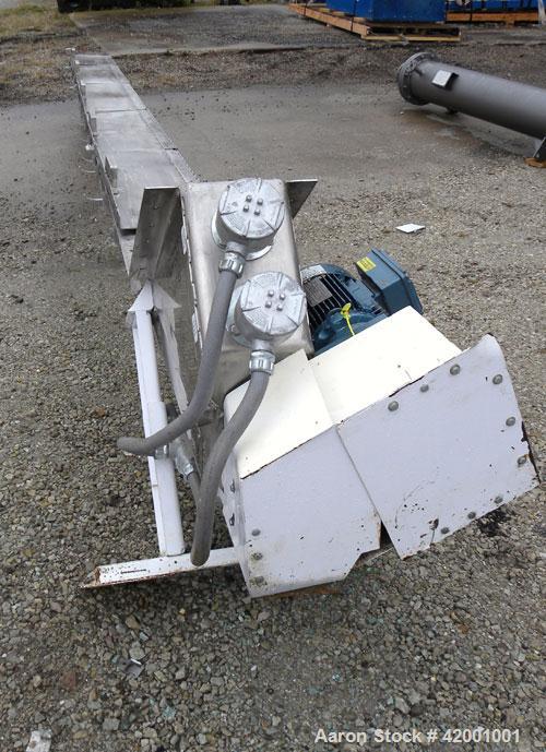 Used Inclined Screw Conveyor, 304 Stainless Steel. 6" diameter x 200" long x 3" pitch screw. 5 top cover sections. Top end feed, 7-1/2" end bottom outlet. Trough approximately 7" wide x 9" deep. Driv...