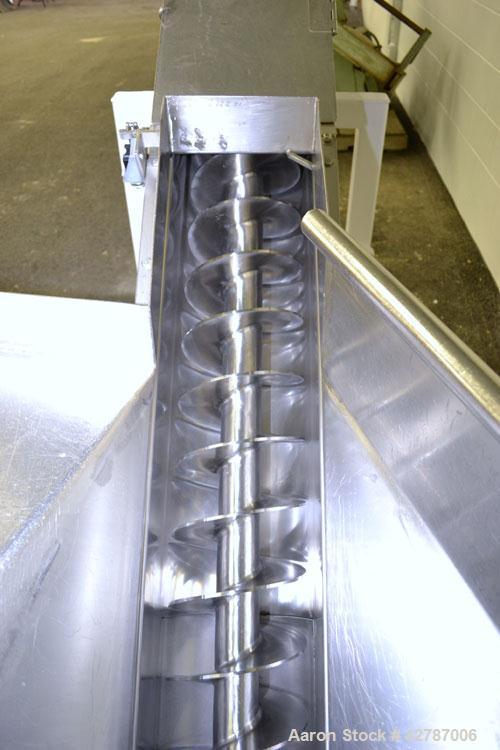Used Inclined Screw Conveyor, 304 Stainless Steel. 9" Diameter x 101" long x 2’’ pitch screw. 10’’ Wide trough with (1) section hinged cover. End feed hopper with hinged safety grate. Top outlet, app...