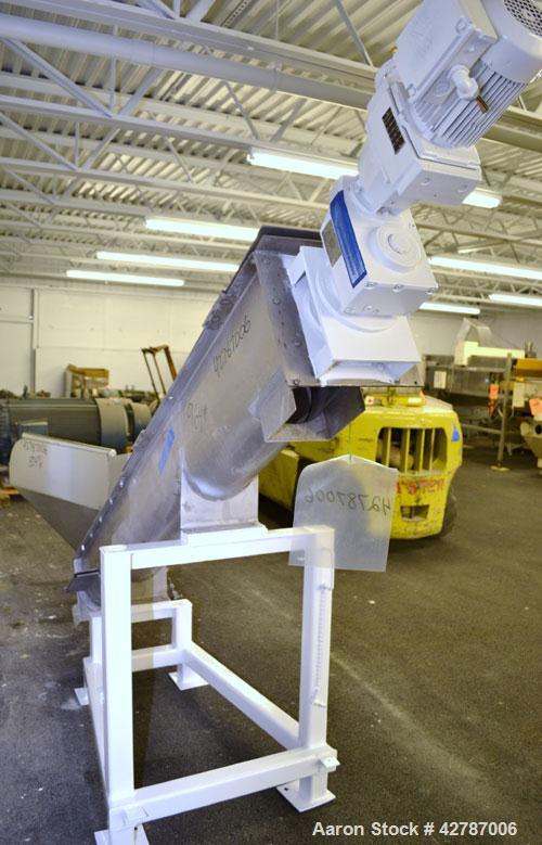 Used Inclined Screw Conveyor, 304 Stainless Steel. 9" Diameter x 101" long x 2’’ pitch screw. 10’’ Wide trough with (1) section hinged cover. End feed hopper with hinged safety grate. Top outlet, app...