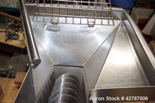 Used Inclined Screw Conveyor, 304 Stainless Steel. 9" Diameter x 101" long x 2’’ pitch screw. 10’’ Wide trough with (1) section hinged cover. End feed hopper with hinged safety grate. Top outlet, app...