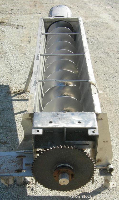 Used Incline Screw Conveyor, 304 stainless steel. 12" diameter x 95" long x 4" pitch screw. Trough 15 3/16" wide x 73 7/8" long x 13" deep. End feed and discharge, approximate 23 1/2" discharge heigh...