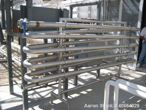 Used Incline Screw Conveyor, 304 stainless steel. 12" diameter x 95" long x 4" pitch screw. Trough 15 3/16" wide x 73 7/8" long x 13" deep. End feed and discharge, approximate 23 1/2" discharge heigh...