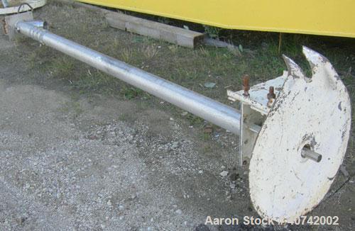 Used Screw Conveyor, 321 Stainless Steel. Approximately 4" diameter  x 128" long screw. Enclosed tube approximately 4 1/2" diameter x 128" long.  4" tri - clamp inlet/outlet.  No motor.