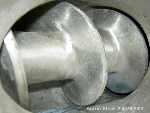 Used Screw Conveyor, 321 Stainless Steel. Approximately 4" diameter  x 128" long screw. Enclosed tube approximately 4 1/2" diameter x 128" long.  4" tri - clamp inlet/outlet.  No motor.