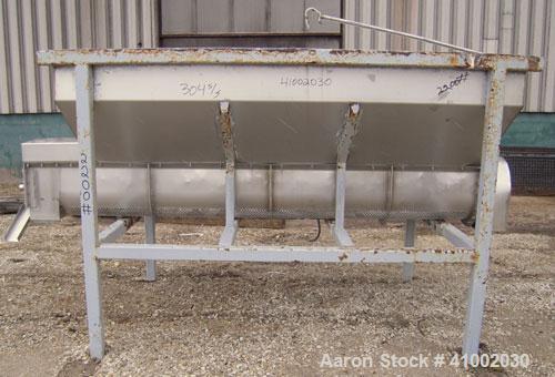Used Dewatering Screw Conveyor, 304 stainless steel. 16" diameter x 106" long x 4 1/2" pitch screw, perforated bottom trough with 1/2" diameter holes. Top mounted hopper 62" wide x 105" long x 28" de...